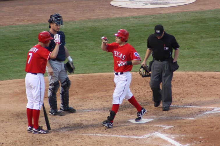 Ian Kinsler crosses home plate after hitting a home run for the Texas Rangers against the Tampa Bay Rays in the 2010 ALDS. Photo by George Walker